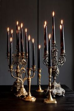 a group of candles sitting on top of a wooden table