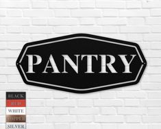 a black and white sign that says pantry on the side of a brick wall,