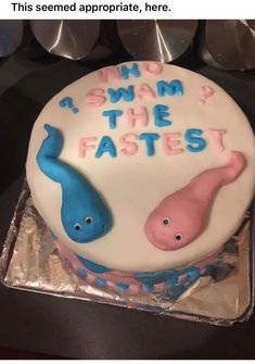 there is a cake that says who swam? the fastest and two blue elephants on it