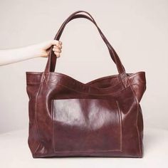 Introducing our Oil Wax Vegan Weekender Tote Bag – a must-have accessory that's in high demand! With an oil wax finish, this tote is available in black, cognac, and burgundy, offering a perfect size for everyday use, weekend getaways, or shopping.Crafted from vegan leather, it features an oil wax look and feel that adds a touch of sophistication. Measuring 16 inches by 12.6 inches, with a 5-inch gusset, this tote strikes the ideal balance between style and practicality.Elevate your fashion with Vacation Tote Bag, Luxury Leather Bag, Soft Leather Tote, Pu Leather Bag, Vintage Shoulder Bag, Casual Tote, Tote Bag Leather, Shoulder Tote Bag, Large Bag