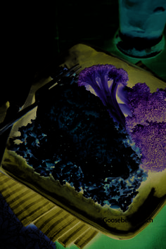 a piece of cake with purple frosting on it