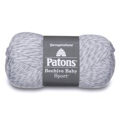 a ball of yarn with the words patons in white and grey colors on it