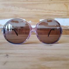 "Vintage oversized round sunglasses for women, with purple plastic frame, silver metal arms and grayish-brown lenses. Original high quality vintage from a new-old stock, never been used and in mint condition. Also available in blue: https://www.etsy.com/listing/877568231/70s-oversized-round-sunglasses-vintage Measurements: Lens height: approx. 2.2\" / 5.7cm Lens width: approx. 2.3\" / 5.8cm Bridge: approx. 0.5\" / 1.2cm Arm length: approx. 4.7\" / 12cm Total width: approx. 6\" / 15.5cm Total hei Retro Purple Sunglasses With Tinted Lenses, Retro Purple Sunglasses With Mirrored Lenses, Retro Purple Sunglasses With Gradient Lenses, Vintage Purple Sunglasses With Tinted Lenses, Boho Sunglasses, Round Sunglasses Vintage, Oversized Round Sunglasses, Purple Sunglasses, Greyish Brown