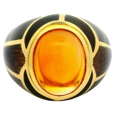 –Stone(s)– (1) Natural Genuine Citrine - Oval Cabochon - Bezel Set - Golden Yellow Color  - 10.16 x 7.96 (approx.) Material: Solid 18k Yellow Gold - Coffee Brown Enamel Weight: 11.04 Grams Ring Size: 6.5 ( fitted on finger, please contact us prior to purchase with sizing inquiries) Ring Width: 15.2mm (0.59") (top of the ring - north to south) - 4.5mm (bottom of the shank) Ring Height: 11.59mm (rise off finger) Condition: Light wear, excellent overall condition. Stock Number: JO-15060333 Gold Mosaic, Sapphire Cocktail Ring, Golden Yellow Color, Vintage Cocktail Ring, Princess Cut Rings, 11 59, Citrine Ring, Citrine Stone, 18k Yellow Gold Ring