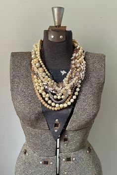 * This is a CUSTOM ORDER, please allow 2-3 weeks for creation! I will be in contact with you the entire time as you choose what specialized rhinestone pieces you want in your unique statement piece made just for you. * This necklace has layers and layers of vintage glass and lucite pearls twisted around two repurposed vintage white enamel flower chain and one flower chain with crystal rhinestone centers.  A vintage white pearl and champagne cabochon bracelet is twisted in at the right with repur Luxury Vintage Polished Beaded Necklaces, Diy Pearl Necklace, Cabochon Bracelet, Flower Chain, Chunky Pearls, Pearl Statement Necklace, Rhinestone Statement Necklace, Pearls Diy, Vintage Dictionary