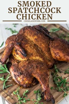 a whole chicken on a cutting board with herbs