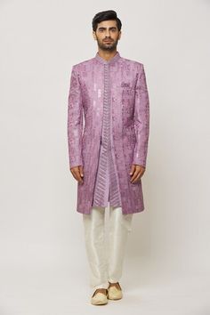 Purple sherwani with all over thread and sequin hand embroidery. Paired with a cream aligadi pant. - Aza Fashions Traditional Raw Silk Sherwani With Mirror Work, Bollywood Style Ceremonial Sherwani With Mirror Work, Bollywood Style Sherwani With Mirror Work For Ceremonial Occasions, Bollywood Style Sherwani With Mirror Work For Ceremonial, Bollywood Sherwani With Mirror Work For Ceremonies, Diwali Reception Sherwani With Resham Embroidery, Bollywood Style Sherwani With Mirror Work For Eid, Ceremonial Sherwani With Mirror Work For Eid, Ceremonial Sherwani With Mirror Work For Diwali