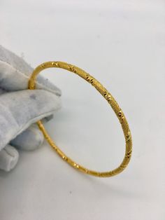 18k Gold Filled Adult Size Bangle PLEASE NOTE THIS LISTING IS FOR 1 BANGLE Adult Size 2.6 Inside Diameter of 6.2 Weight 10grams External Width 2.5mm VELVET CASE SUPPLIED Is This Piece Made Of Solid Gold? No. The item is Gold Filled , used to describe a specific form of gold plating, does not, as the term implies, mean that the item is filled with gold. Looks identical to real gold. It refers to Jewellery made of base metal (commonly brass or copper) covered by sheets of gold bonded to the base by a mechanical process. Gold Filled is much more valuable and tarnish resistant than spray plated. It does not flake off, rub off or change colour and is extremely long lasting if taken care of. Gold Filled Jewellery is an economical alternative to solid gold jewellery. I also sell many other design Gold Bangle Designs, Nepali Jewelry, Gold Bangles Indian, Hand Evil Eye, Gold Bangles For Women, Womens Bangles, Adjustable Bangle Bracelet, Gold Plated Bangles, Gold Bond