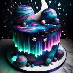 a colorful cake decorated with planets and stars