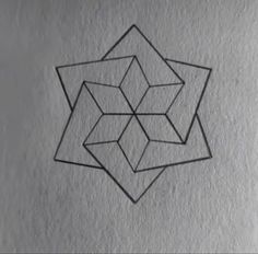 a drawing of three cubes in the middle of a white wall with black ink on it