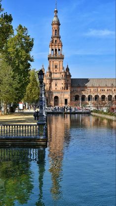 a large building sitting next to a body of water