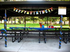 an outdoor birthday party set up under a canopy