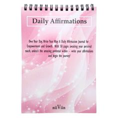 a pink spiral notebook with the words daily affirmations written on it's cover