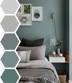 a bedroom with green walls and grey bedding, pictures on the wall above it