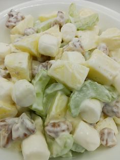 a white plate topped with lettuce and cheese