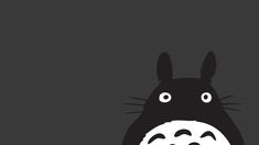 a black and white image of totoro with his mouth open in the dark