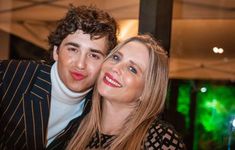 a man and woman posing for a photo together