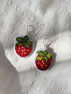 These beaded strawberry earrings will be the sweetest addition to your collection🍓 Materials: Glass Seed Beads paired with Stainless Steel Hypoallergenic Earring Hooks and backed with secondhand genuine leather.  Care instructions: This one-of-a-kind piece was handmade with intentionality and care. To ensure they are kept in pristine condition, I recommend removing before entering water (i.e. the shower/bath, pools, ocean, etc.), and storing flat or hanging neatly when not in use. Strawberry Beading Pattern, Cherry Beaded Earrings, Beaded Strawberry Earrings, Beaded Berry Earrings, Beaded Fruit Earrings, Strawberry Earrings Beaded, Hypoallergenic Earrings, Seed Beads, Bead Work