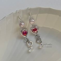 "Handmade Beaded Earrings ✿ Made with glass beads, freshwater pearls, glass crystal beads, and metal accents ✿ Silver, iridescent clear, cherry red, and pearlescent peach ✿ The earrings are 2.9\" long Fish Hook Options ✿ The Titanium fish hook is hypoallergenic and ideal for sensitive skin ✿ The regular fish hook is made of nickel free metal, it is not hypoallergenic" Dangle Pearl Earrings For Valentine's Day, Valentine's Day Dangle Pearl Earrings, Pink Metal Dangle Beaded Earrings, Pink Beaded Dangle Pearl Earrings, Red Dangle Pearl Earrings, Pink Crystal Earrings For Jewelry Making, Pink Metal Beaded Earrings For Gifts, Pink Metal Beaded Earrings As Gift, Red Pearl Dangle Earrings