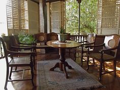 a living room filled with furniture and an umbrella