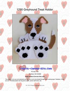 a crocheted dog with paw prints on it's chest is shown in front of hearts