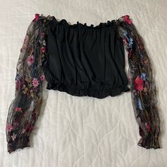 Black Cropped Off Shoulder Too With Sheer Embroidered Floral Sleeves Nwot Chic Black Tops With Floral Embroidery, Black Tops With Floral Embroidery For Night Out, Black Top With Floral Embroidery For Night Out, Black Floral Print Top For Evening, Black Floral Embroidery Tops For Evening, Black Floral Print Party Tops, Black Embroidered Tops For Night Out, Black Floral Print Festival Tops, Black Floral Print Top For Festival