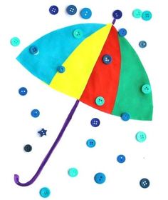 an umbrella made out of buttons with the words button rain craft on it's side