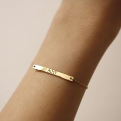 "Personalized Gold Bar Bracelet, Name Bracelet, 14K Solid Gold Bracelet, Simple Name Bar Bracelet, Layering Jewelry, Gifts for Her ≫ Product Details ◈ Handmade / Handcrafted Fine Jewelry ◈ Bar Size: 35mm x 4mm ◈ Thickness: 1.30mm ◈ Metal: Solid 14K Gold ◈ Gold Color: White gold, Rose gold, Yellow gold ◈ Chain Length: 6\" ~ 7.5\" ≫ Please read our FAQ below for more detail." Everyday 14k Gold Engraved Bracelet, Modern Engraved Yellow Gold Name Bracelet, Minimalist Yellow Gold Nameplate Bracelet, Elegant Yellow Gold Rectangular Name Bracelet, 14k Gold Name Bracelets For Everyday, 14k Gold Nameplate Bracelet For Everyday, Everyday 14k Gold Nameplate Bracelet, Classic 14k Gold Name Bracelet With Jubilee Detail, Classic 14k Gold Name Bracelet With Jubilee Design