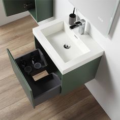 a white sink sitting under a mirror in a bathroom