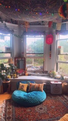 a living room filled with furniture and lots of windows