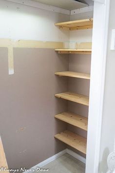 the closet is empty and ready to be used as a storage area for books or other items