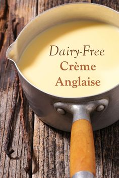 dairy - free creme angaise in a saucepan on an old wooden table