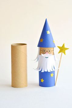 a toilet paper roll is next to a cardboard tube with a gnome face on it