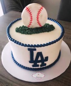 a cake that has a baseball on top of it