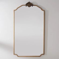 an ornate mirror hanging on the wall