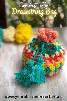 a crochet bag sitting on top of a wooden table