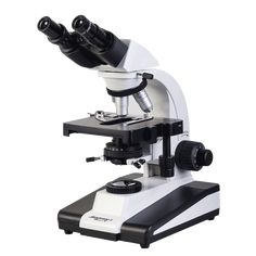 a white and black microscope sitting on top of a table