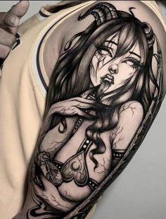 a woman with horns on her head is depicted in this black and white tattoo