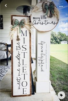 a wooden sign that says merry little christmas and is hanging on the front door of a house