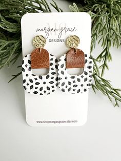 "You will be just as obsessed with these super fun small retro dangles as we are! A perfect every day earring for business or pleasure. This earring offer a neutral color palette. White with black in a geometric pattern, paired with a saddle brown leather connector. Gold post.  These earrings are very lightweight and comfortable! Measure approx 1.5\" in length, these are versatile for all ages!" Boho Faux Leather Earrings, Color Palette White, Cricut Earrings, Handmade Leather Jewelry, Diy Leather Earrings, Small Dangle Earrings, Womens Earrings, Nails Today, Pink Accessories