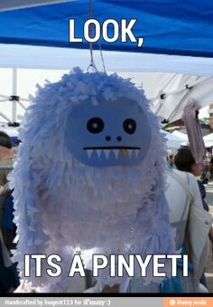 a white furry creature hanging from a blue tent