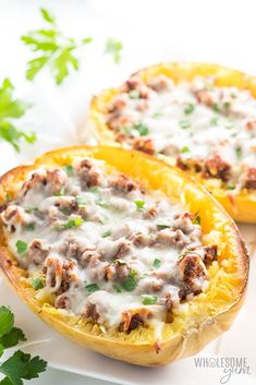 two stuffed squash halves with meat and cheese