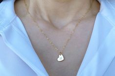 This beautiful and personalized gold heart necklace would be a perfect Valentine's gift for any loved one! The gold plated heart charm measures approximately 21x16mm (including jump ring) and is hung on a 16", 18" or 20" gold plated or 14k gold filled chain. The chains are dainty and very pretty - the perfect delicate necklace for everyday wear. You can also add multiple hearts to the necklace. This sweet necklace is sure to be one of the recipient's favorite piece of jewelry!Please add the lett Heart Initial Necklace, Letter Necklace Gold, September Birthstone Necklace, March Birthstone Necklace, Bridesmaid Flower, Heart Letter, Gold Letter Necklace, Sweet Necklace, Aquamarine Necklace