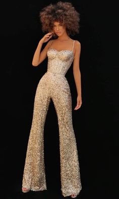 Flatter your finest assets as you enthral the crowd in this Tarik Ediz 51163 jumpsuit. This jumpsuit highlights a corset bodice with a sweetheart neckline supported by thin straps. With it being fully sequined, it is also accented by belt completing the whole look of this full length piece. Look sophisticated and classy with this Tarik Ediz jumpsuit. Model is wearing Gold color. Glitter Jumpsuit Sparkle, Fancy Jumpsuit Prom, Performance Jumpsuits, Jumpsuit Elegant Prom, Disco Glam Outfits, Formal Jumpsuit Prom, Jumpsuits For Prom, Gold Pantsuit, Sequin Jumpsuit Outfit