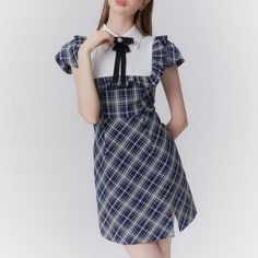 A classic dress that will make you look like a sophisticated literary girl. She is fascinated by the dark navy plaid pattern. Frills are decorated from her shoulders to her chest. An item that combines quality and cuteness. 
 
 
 Size 
 
 
 
 
 S size 
 
 Length: 84cm 
 Shoulder width: 34cm 
 Bust: 86cm 
 Waist: 66cm 
 
 M size 
 
 
 Length: 85.5cm 
 Shoulder width: 35cm 
 Bust: 90cm 
 Waist: 70cm 
 
 L size 
 
 Length: 87cm 
 Shoulder width: 36cm 
 Bust: 94cm 
 Waist: 74cm 
 
 
 
 
 
 
 
 
 Mat Elegant Plaid Mini Dress, Elegant Plaid Dresses With Ruffles, Elegant Mini-length Plaid Dress, Elegant Mini Length Plaid Dress, Plaid Short Sleeve Dress For School, Elegant Gingham Mini Dress, Classic Dress, Plaid Pattern, Dark Navy