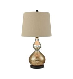 a lamp that is sitting on top of a wooden base and has a beige shade