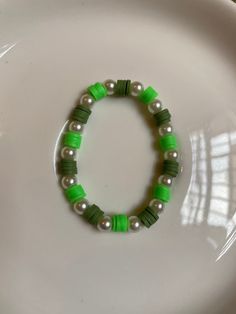 Green, pearl bracelet Cute Green Bracelet Ideas, Clay Beads Green Ideas, Green And White Clay Bead Bracelet, Green Beaded Pearl Bracelets, Green Bracelet Clay Bead, Green Pearl Beaded Bracelets, Playful Green Beaded Bracelets, Green Clay Bead Bracelet, Green Valley