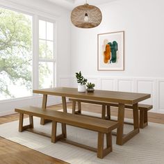 a wooden table and bench in a room