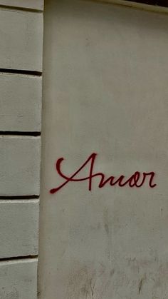 graffiti on the side of a building that says'arvor'in red ink