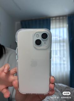 a person holding up an iphone case in their hand, with the camera on it's side